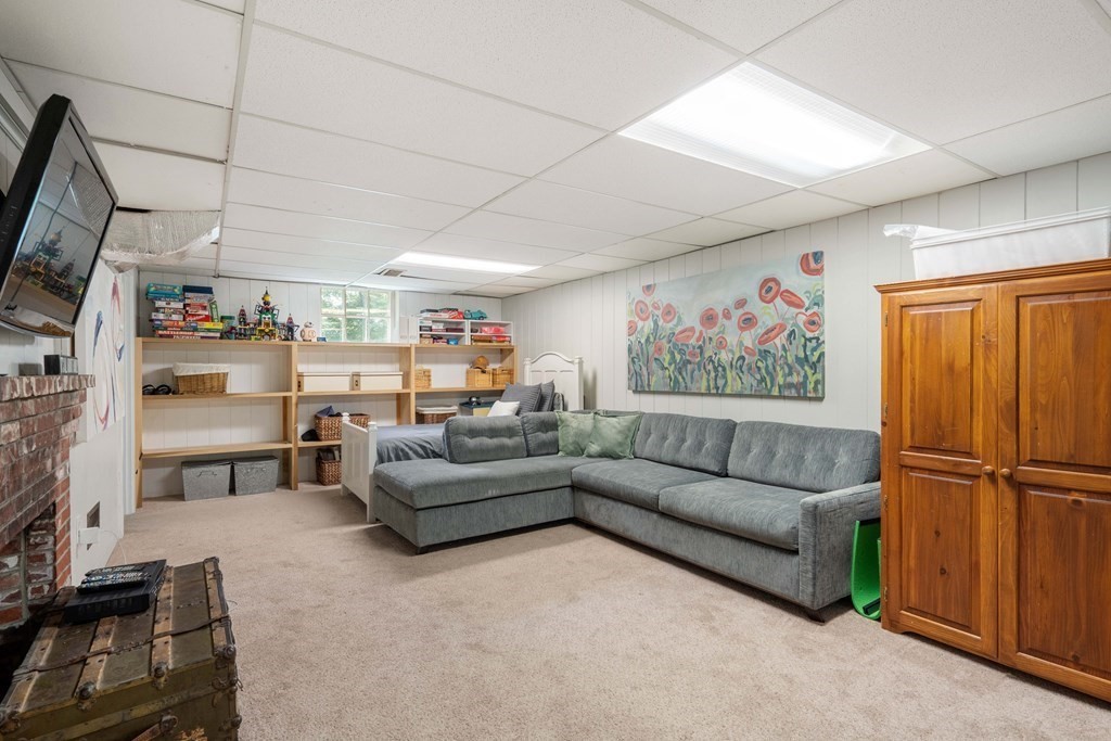 20 Chatham Circle Wellesley, MA 02481 - Photo 24 of 30 a living room with furniture a flat screen tv and a window
