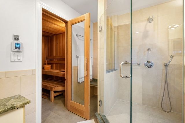 a bathroom with a shower and a sink
