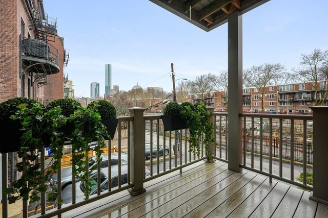 a view of a balcony with city view