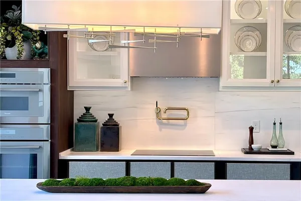 a kitchen with a refrigerator and window