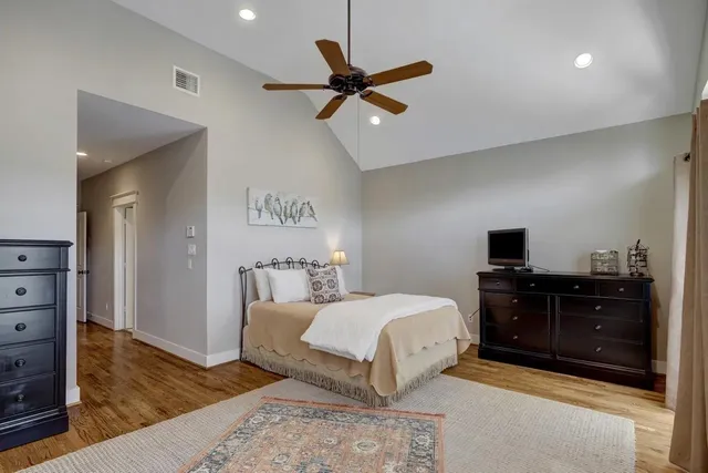 a bedroom with a bed and a dresser