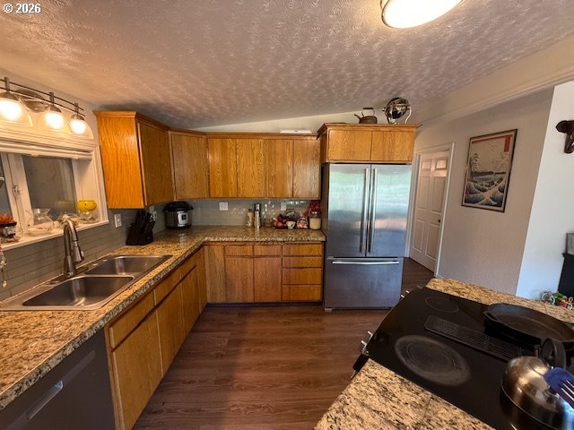 8429 Duncan Island Road Mapleton, OR 97453 - Photo 11 of 24 a kitchen with a stove a sink and a refrigerator