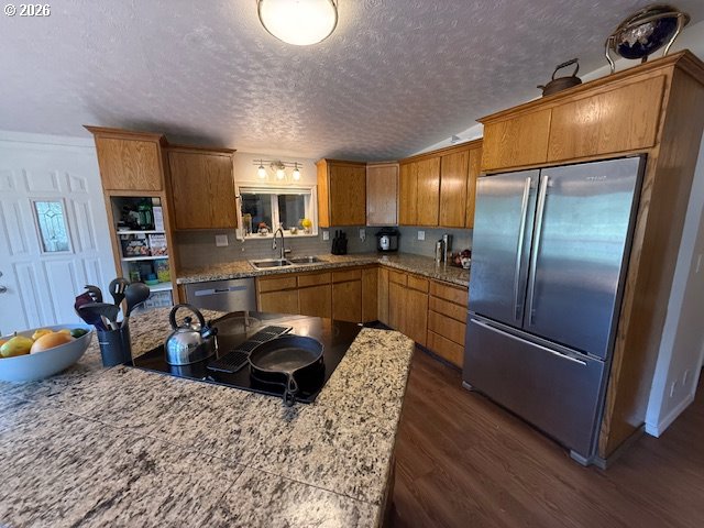 8429 Duncan Island Road Mapleton, OR 97453 - Photo 13 of 24 a kitchen with stainless steel appliances granite countertop a refrigerator a sink a stove and a refrigerator