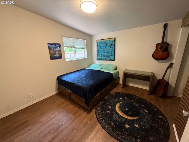 8429 Duncan Island Road Mapleton, OR 97453 - Photo 14 of 24 a living room with a couch and a wooden floor