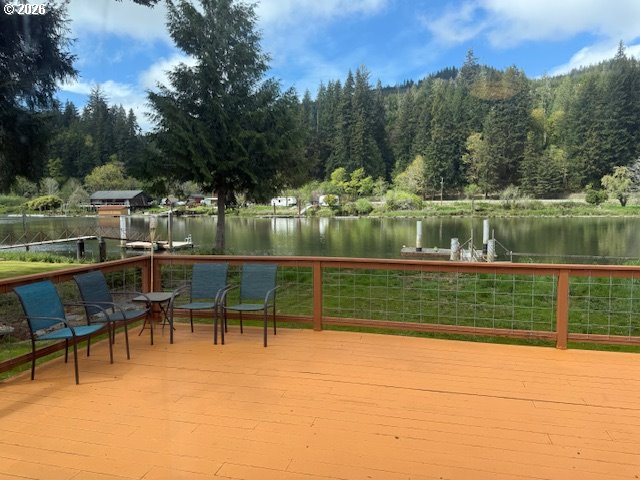 8429 Duncan Island Road Mapleton, OR 97453 - Photo 20 of 24 a view of lake with a table and chairs