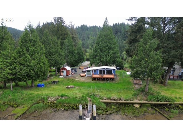 8429 Duncan Island Road Mapleton, OR 97453 - Photo 2 of 24 a house view with a garden space