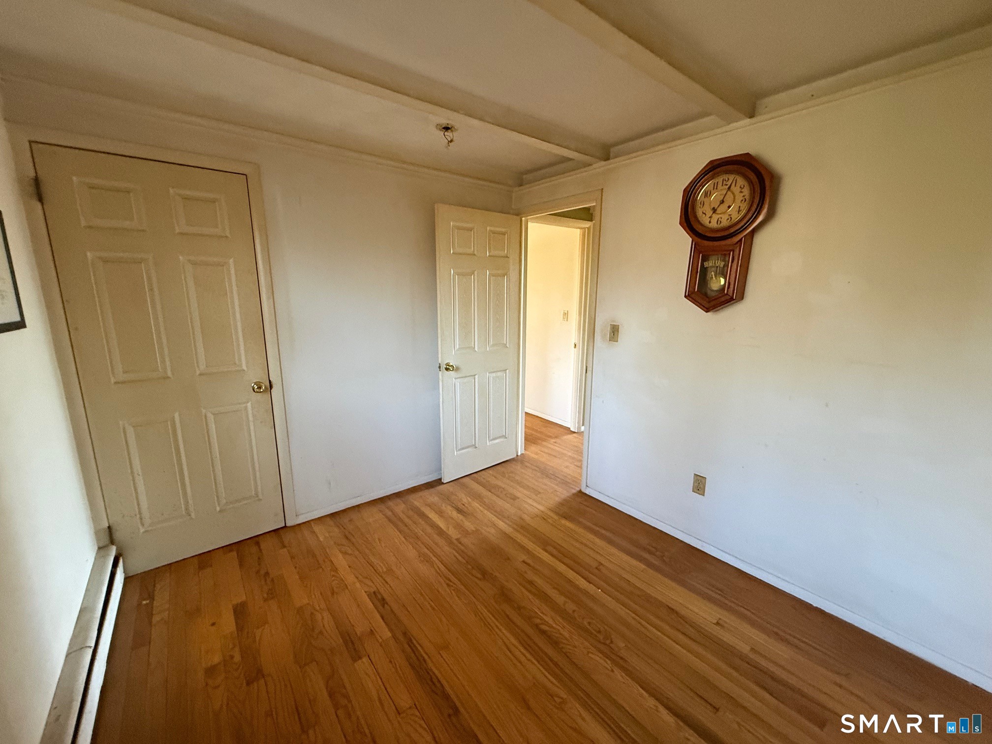 491 Shepard Avenue Hamden, CT 06514 - Photo 11 of 18 a view of a room with wooden floor and white walls