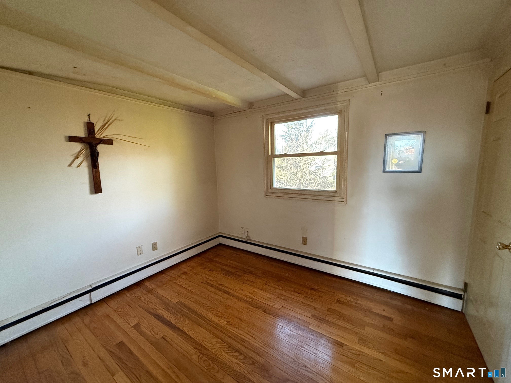 491 Shepard Avenue Hamden, CT 06514 - Photo 12 of 18 a view of empty room with window and wooden floor