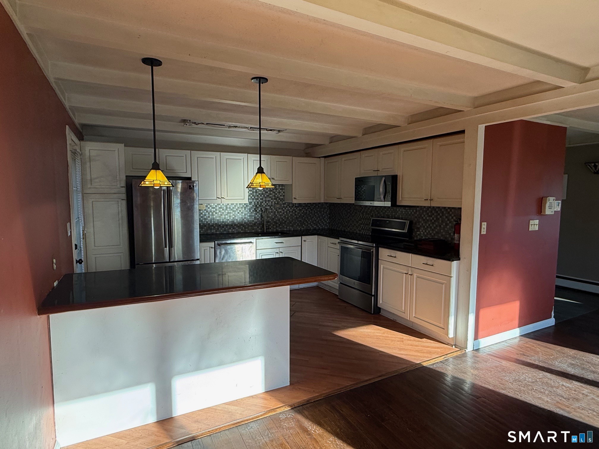 491 Shepard Avenue Hamden, CT 06514 - Photo 3 of 18 a kitchen with stainless steel appliances granite countertop a sink a stove and a wooden floors