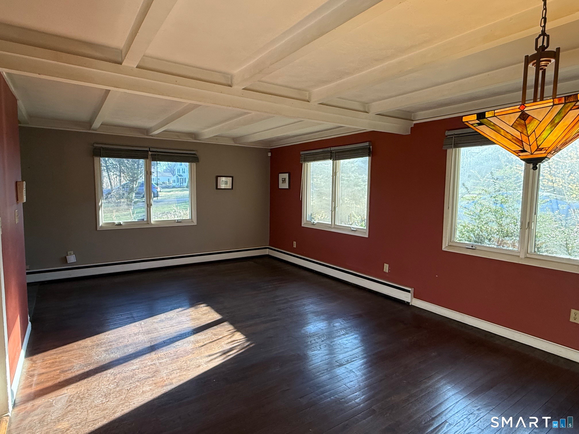 491 Shepard Avenue Hamden, CT 06514 - Photo 5 of 18 a view of an empty room with wooden floor and a window