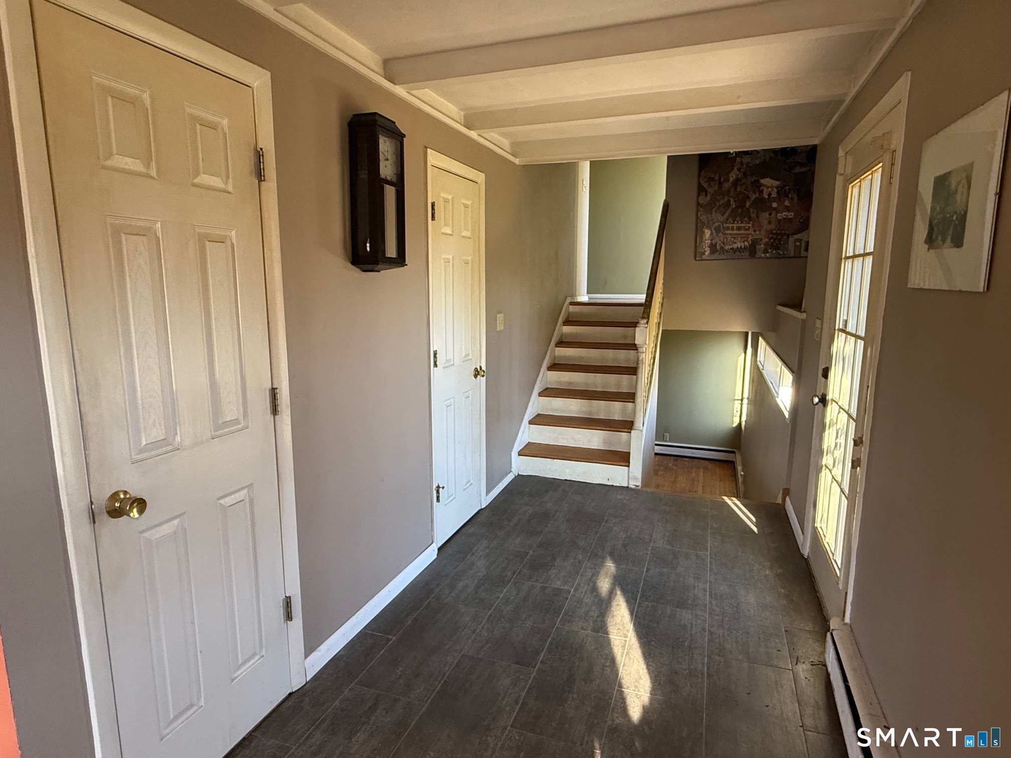 491 Shepard Avenue Hamden, CT 06514 - Photo 6 of 18 a view of a hallway with wooden floor and entryway