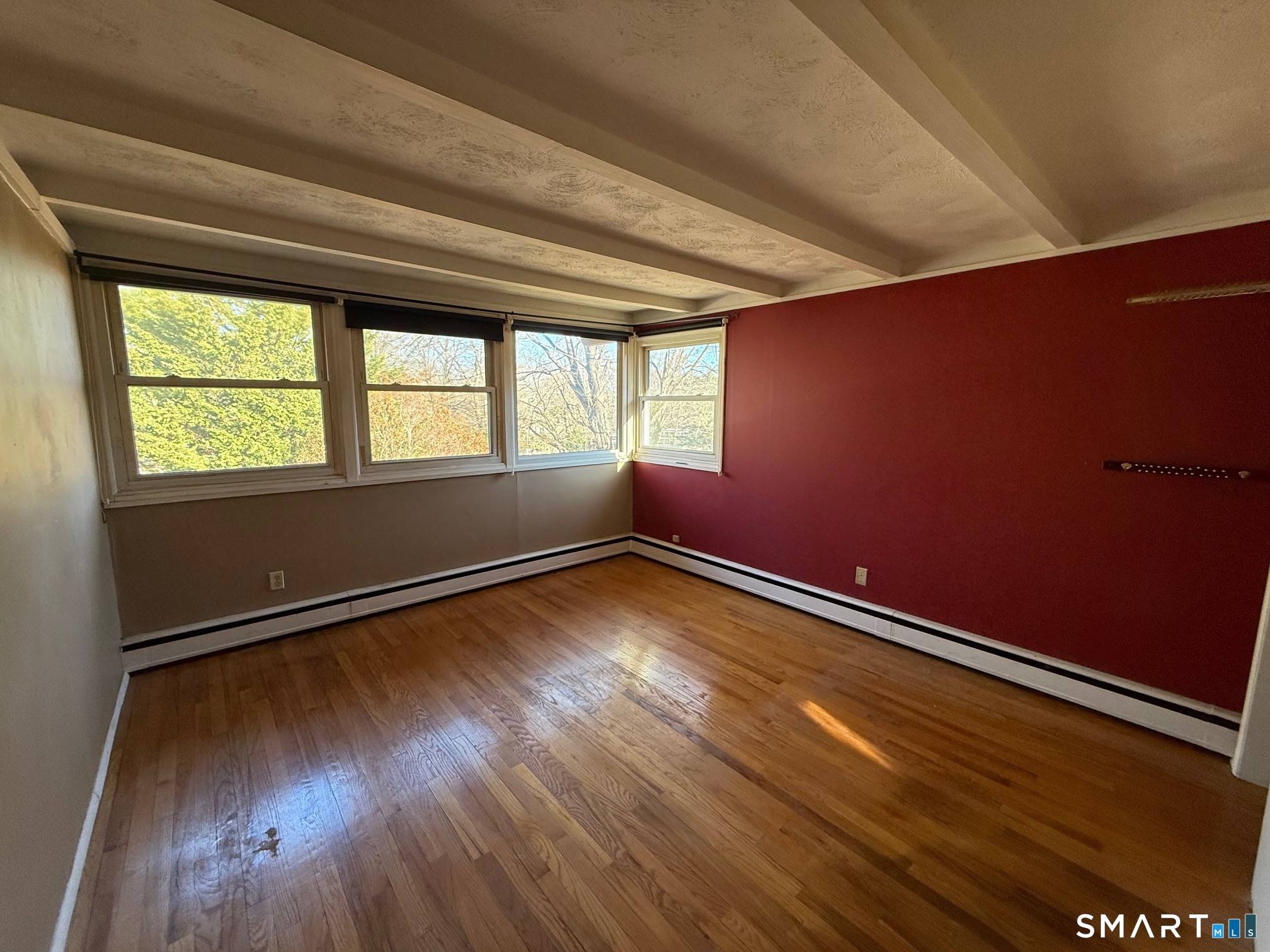 491 Shepard Avenue Hamden, CT 06514 - Photo 7 of 18 an empty room with wooden floor and windows