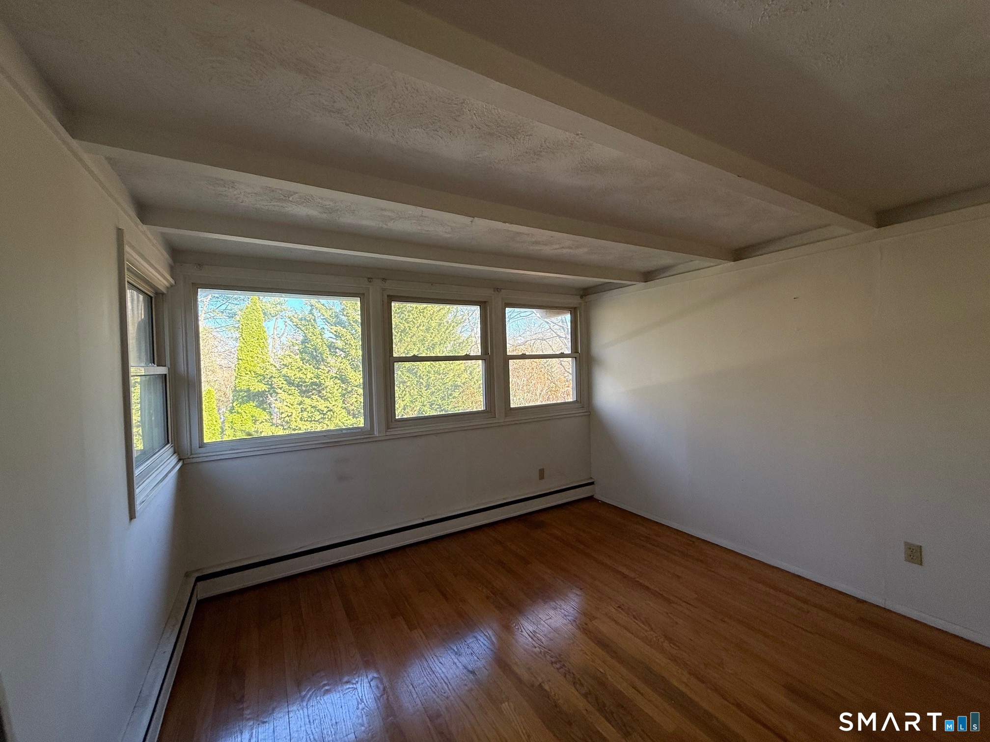 491 Shepard Avenue Hamden, CT 06514 - Photo 10 of 18 a view of room with window and wooden floor
