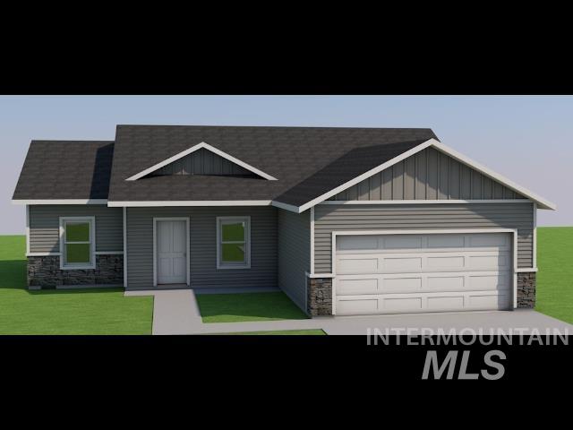 930 Latemar Road Jerome, ID 83338 - Photo 2 of 6 Craftsman-style home with stone siding, a front yard, and a garage