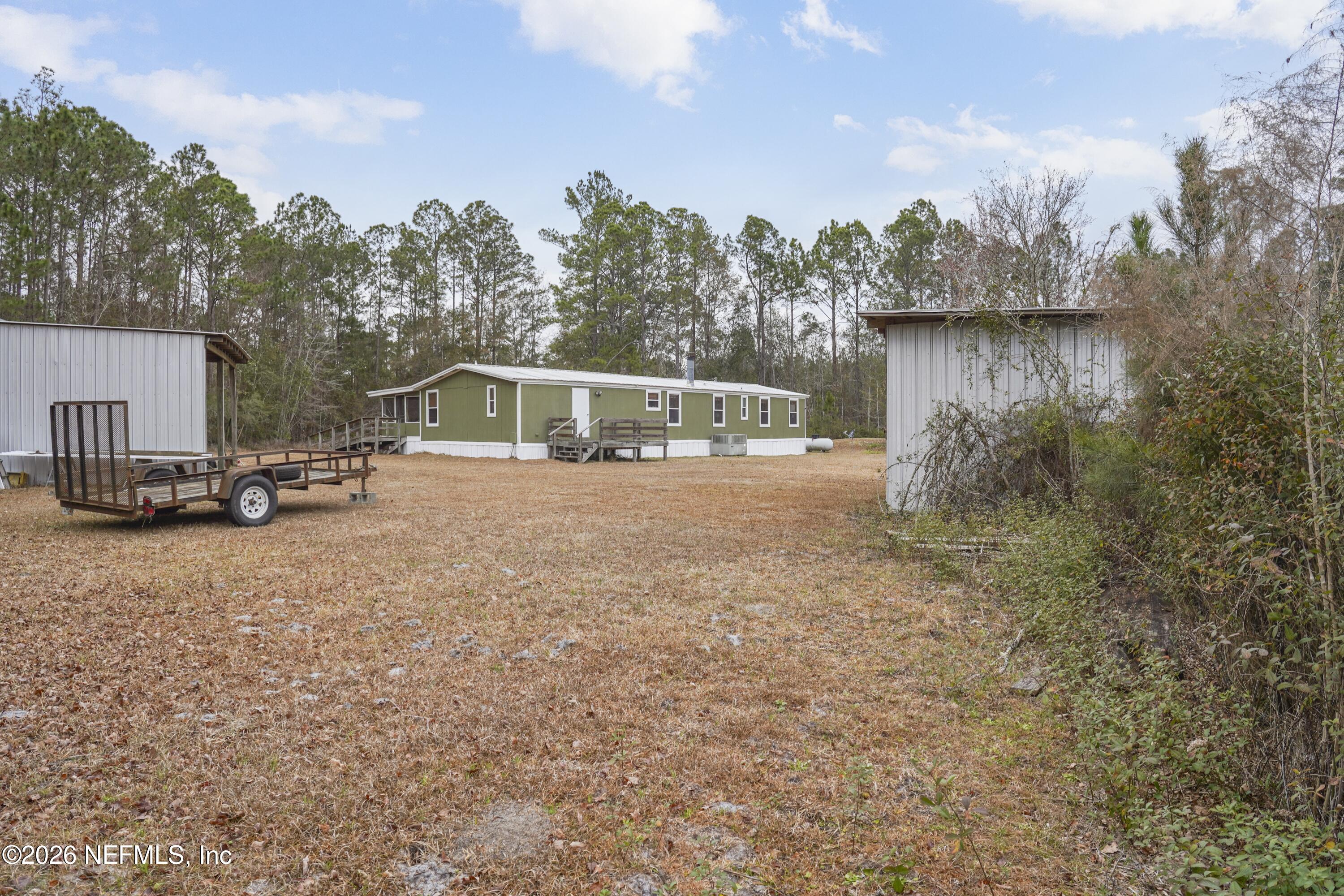 10697 County Road 127 Sanderson, FL 32087 - Photo 12 of 40 a view of a lake with houses