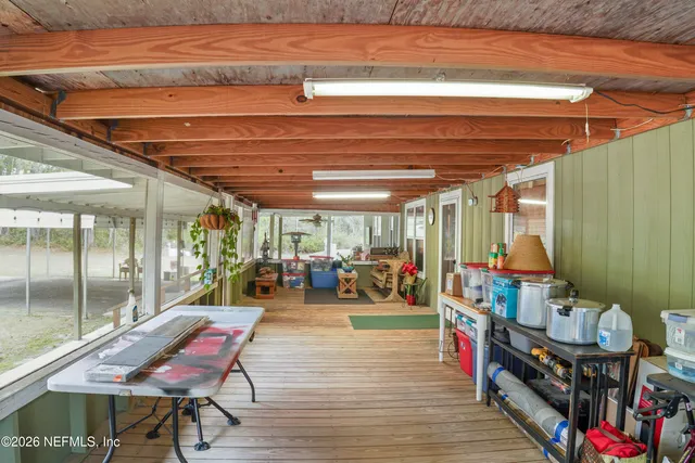 a room with lots of wooden furniture and a table