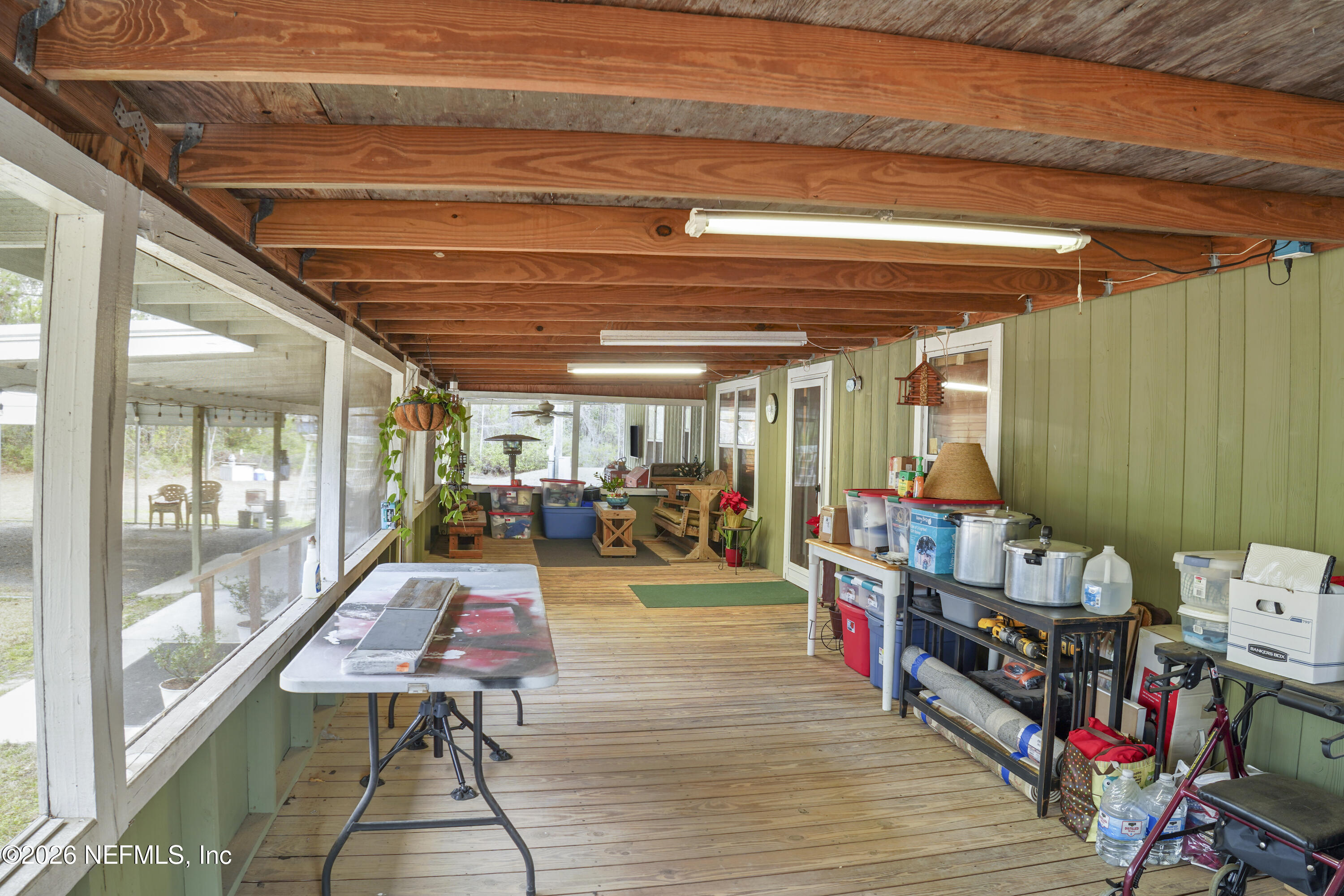 10697 County Road 127 Sanderson, FL 32087 - Photo 20 of 40 a room with lots of wooden furniture and a table