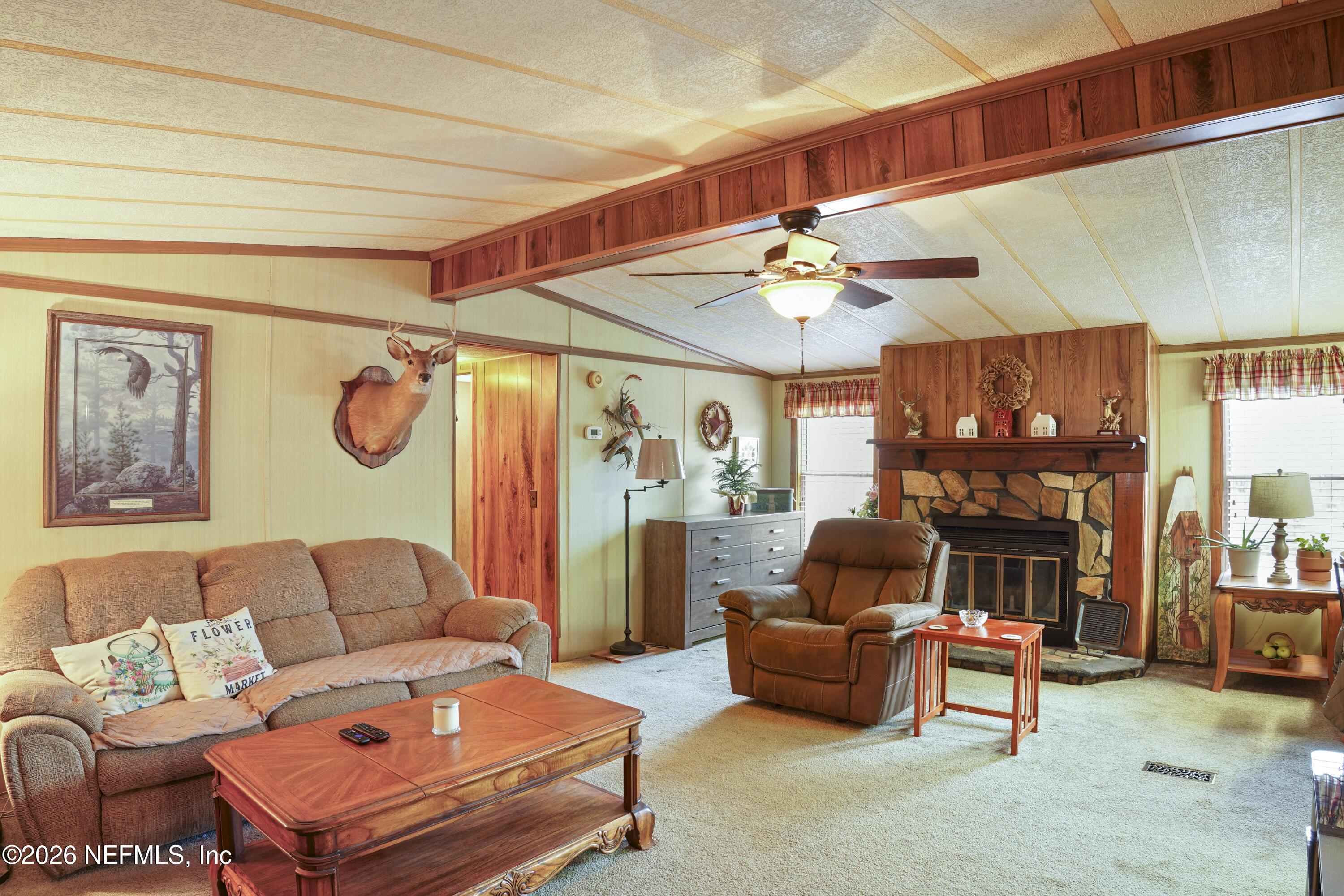 10697 County Road 127 Sanderson, FL 32087 - Photo 21 of 40 a living room with furniture a ceiling fan and a window