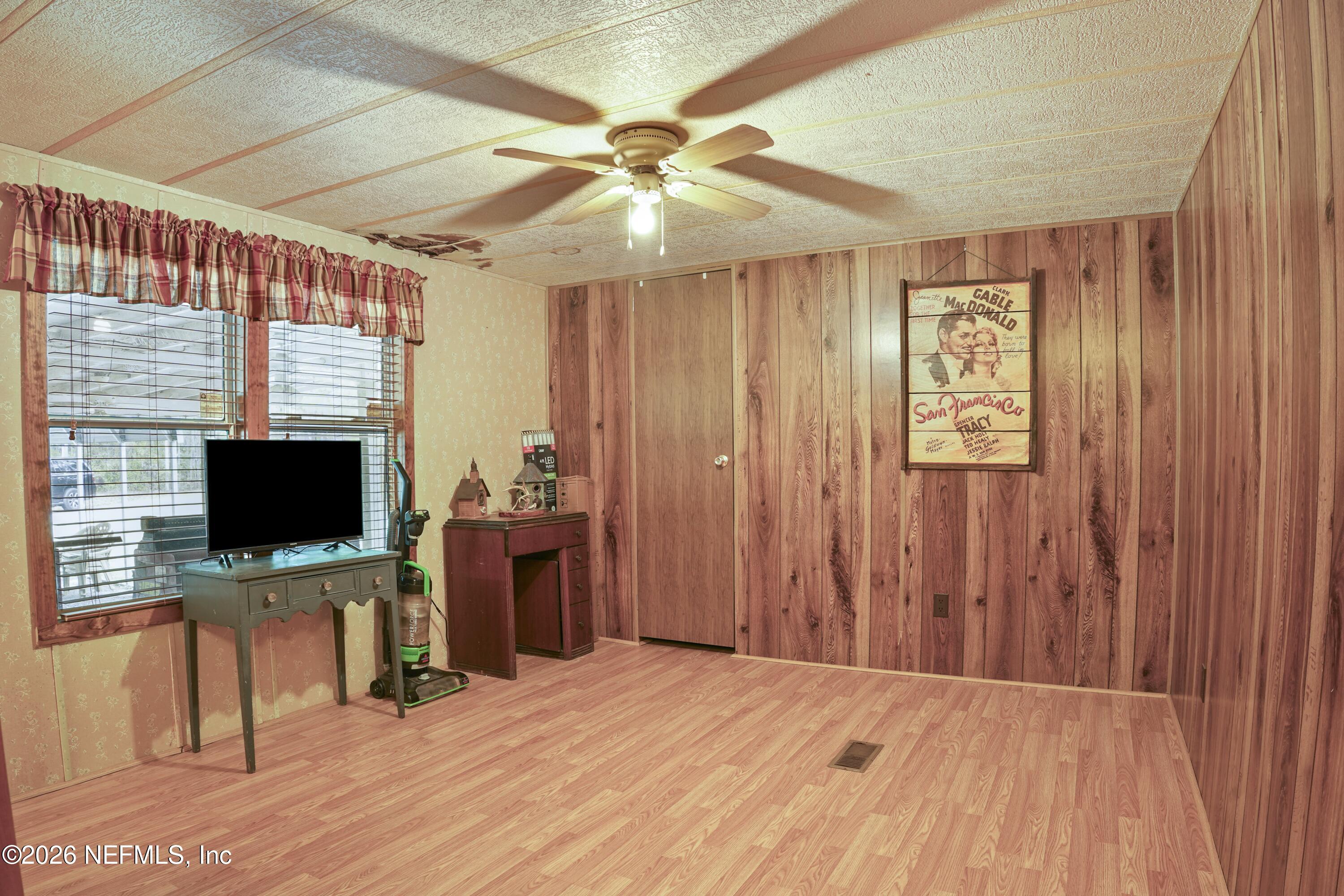 10697 County Road 127 Sanderson, FL 32087 - Photo 22 of 40 a view of a workspace with furniture and a flat screen tv