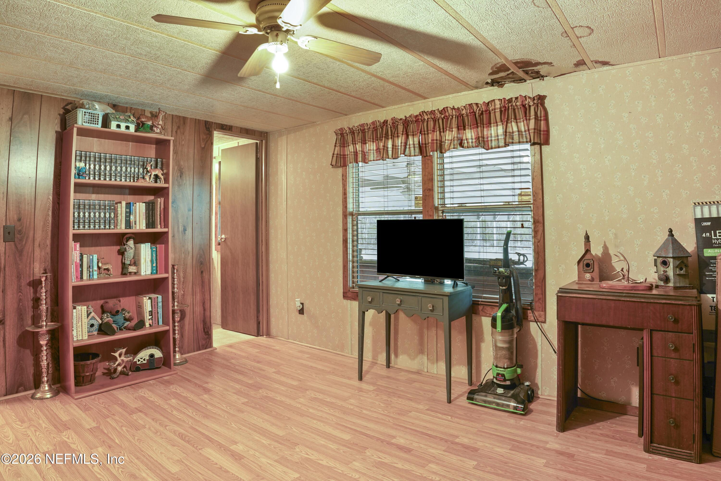 10697 County Road 127 Sanderson, FL 32087 - Photo 23 of 40 a view of a livingroom with workspace and a window