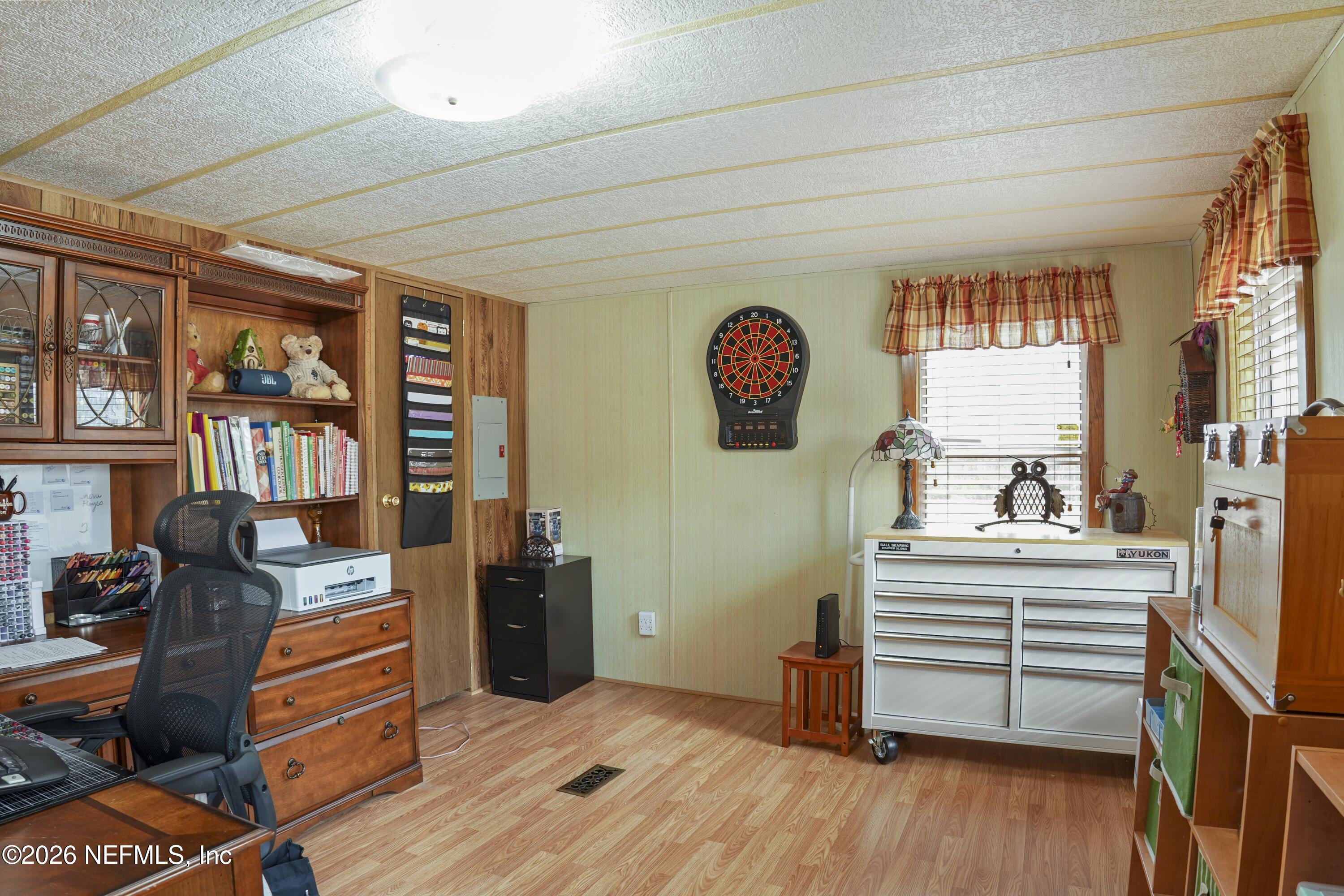 10697 County Road 127 Sanderson, FL 32087 - Photo 26 of 40 a view of a workspace with furniture and a window