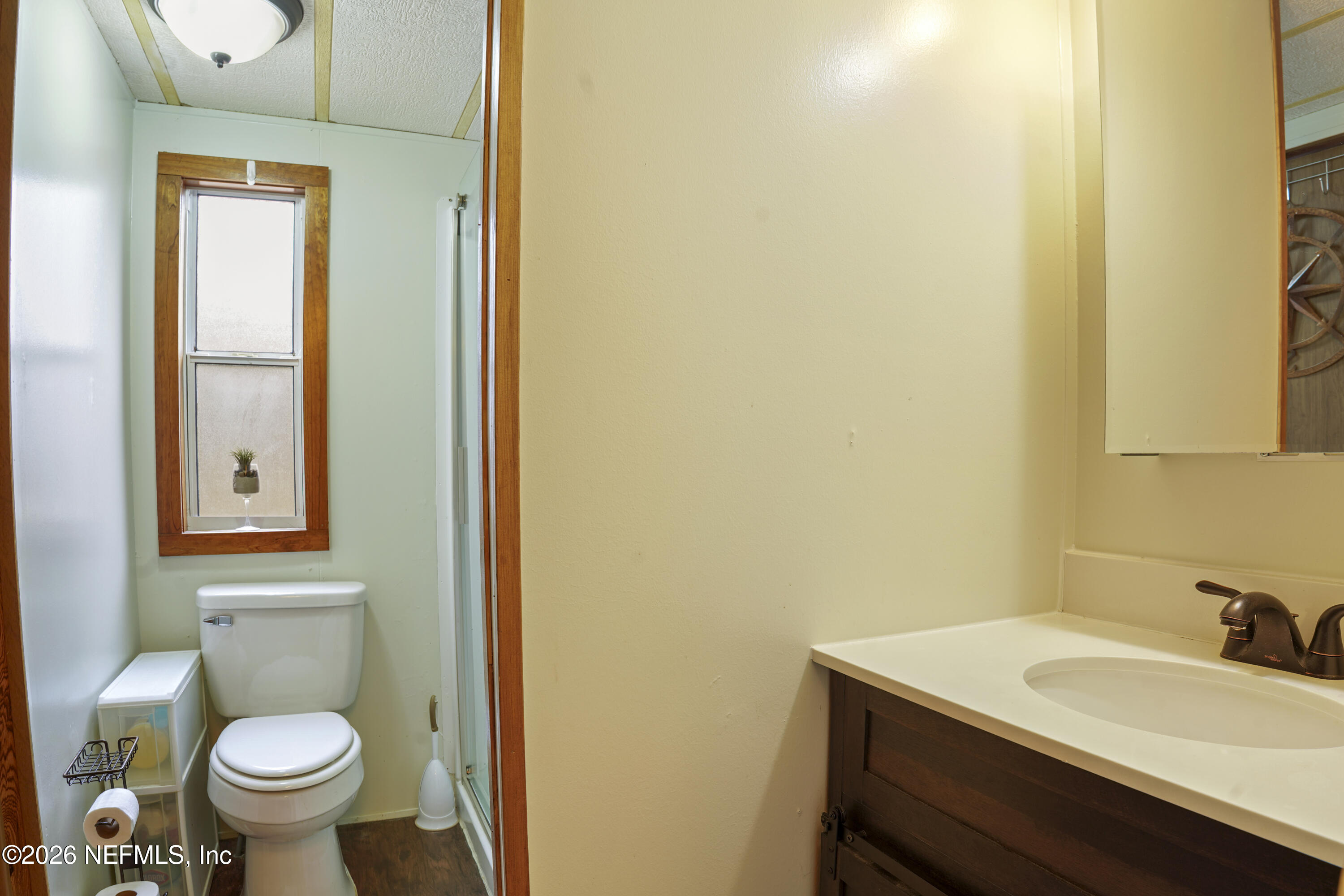 10697 County Road 127 Sanderson, FL 32087 - Photo 27 of 40 a bathroom with a sink and a toilet