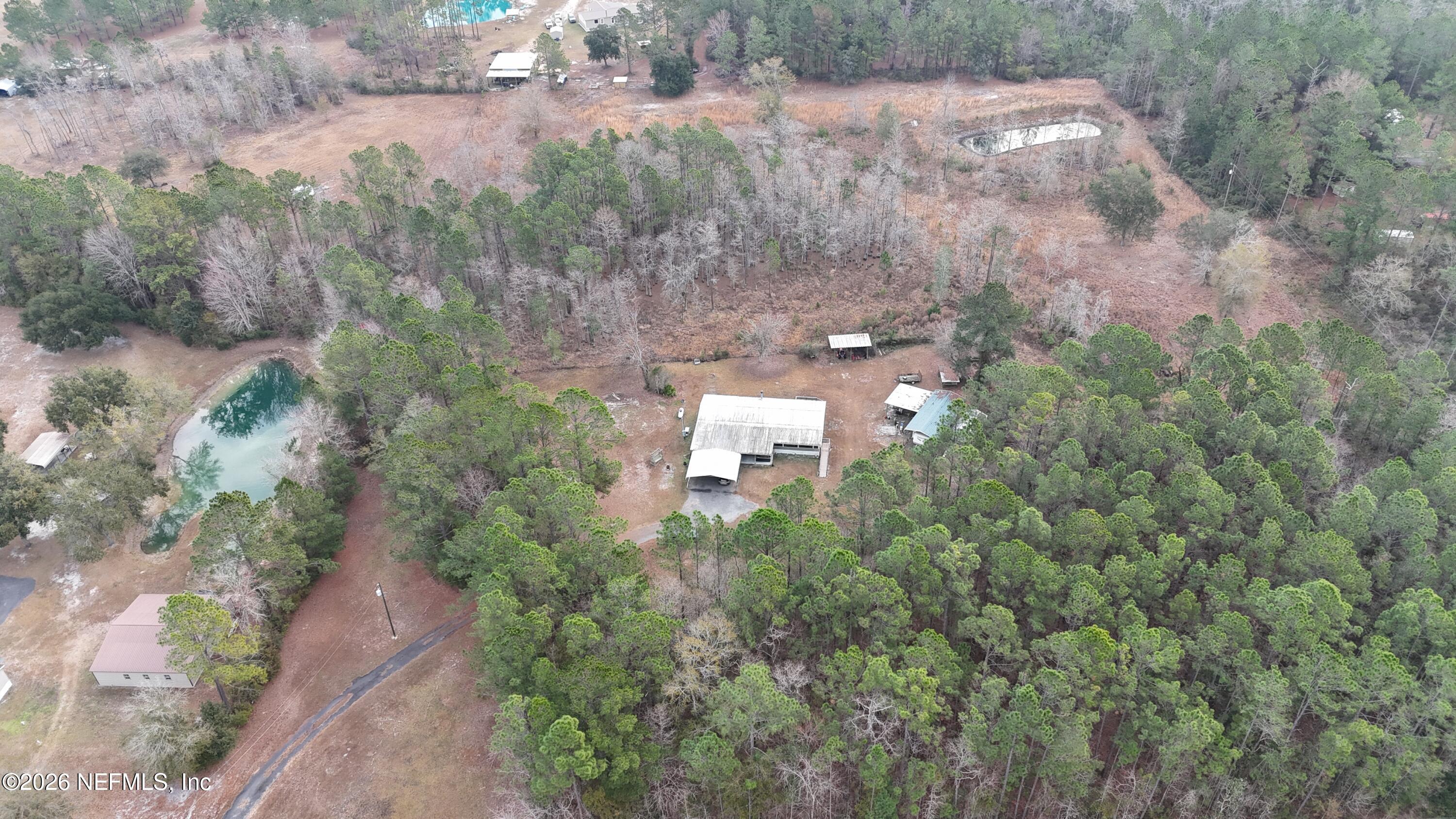 10697 County Road 127 Sanderson, FL 32087 - Photo 3 of 40 an aerial view of a house with a yard and large tree