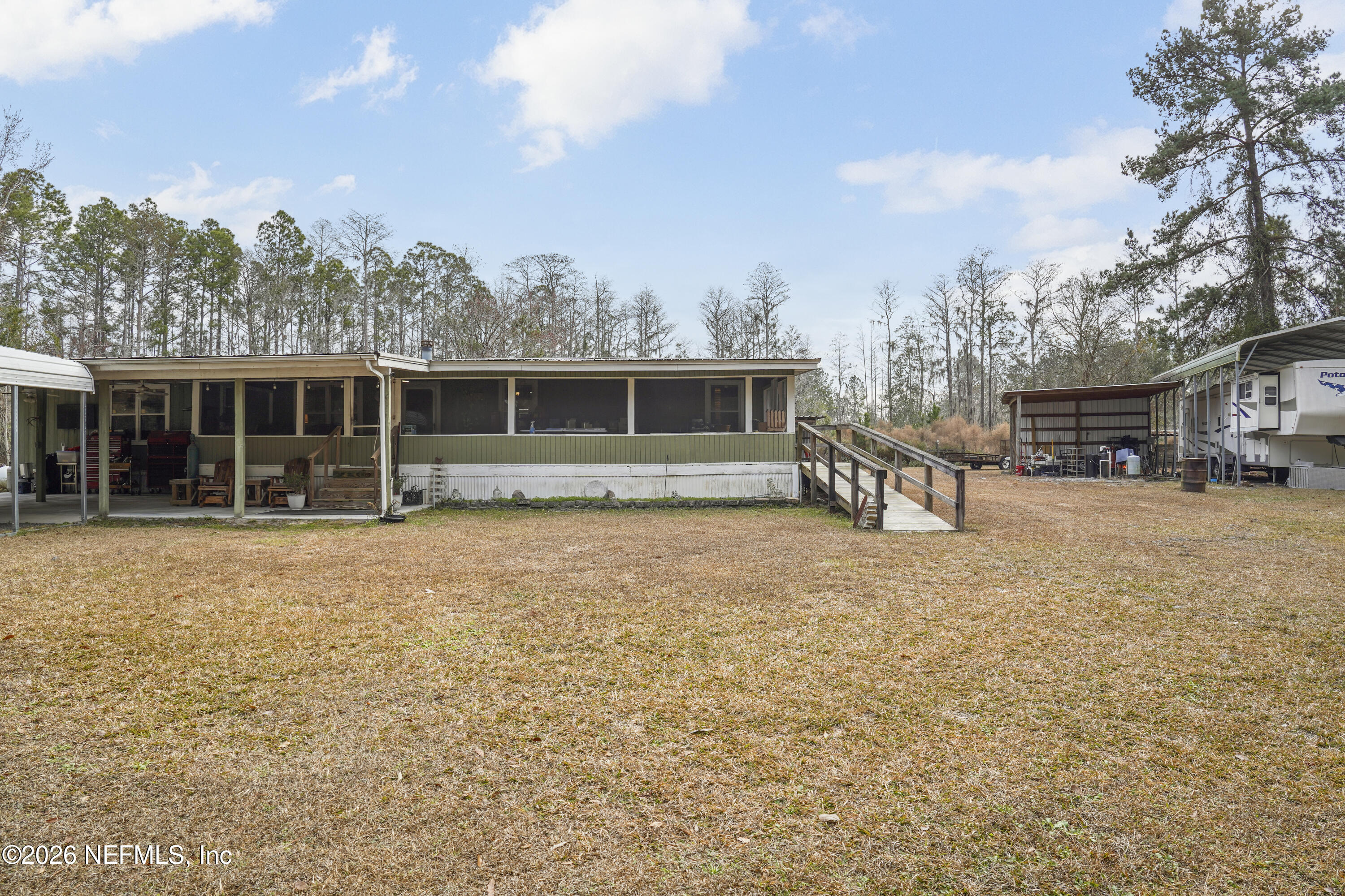 10697 County Road 127 Sanderson, FL 32087 - Photo 40 of 40 a view of a house with a backyard