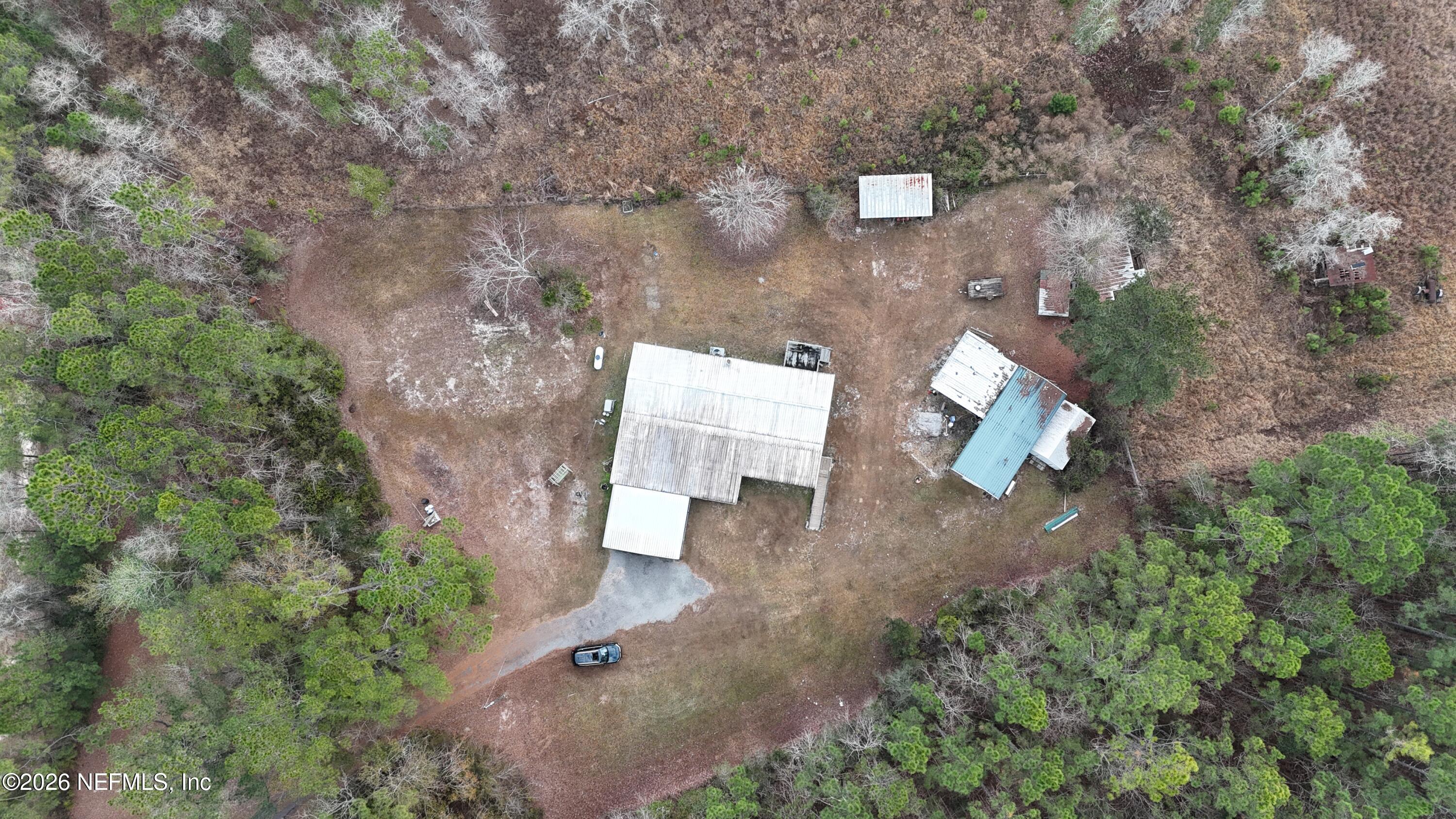 10697 County Road 127 Sanderson, FL 32087 - Photo 4 of 40 an aerial view of a house with outdoor space