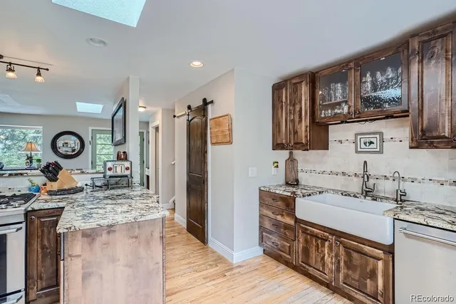 a kitchen with a stove and a window