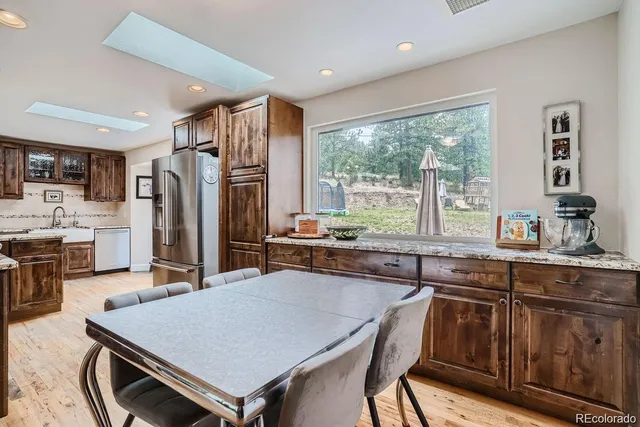 a bedroom with a bed lamp and window