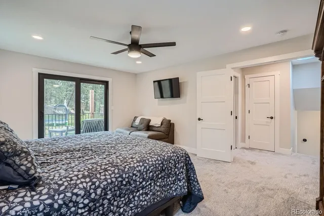 a spacious bathroom with a granite countertop sink and a mirror