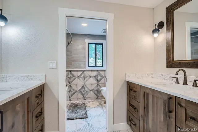 a utility room with sink dryer and washer