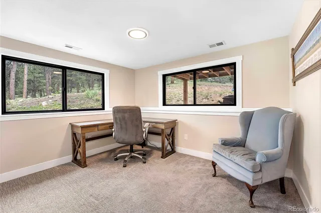 a view of a yard with large trees