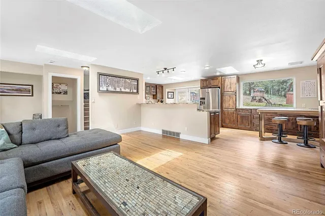 a view of a livingroom with furniture and a fireplace