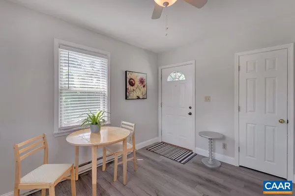 a bedroom with a bed and chandelier