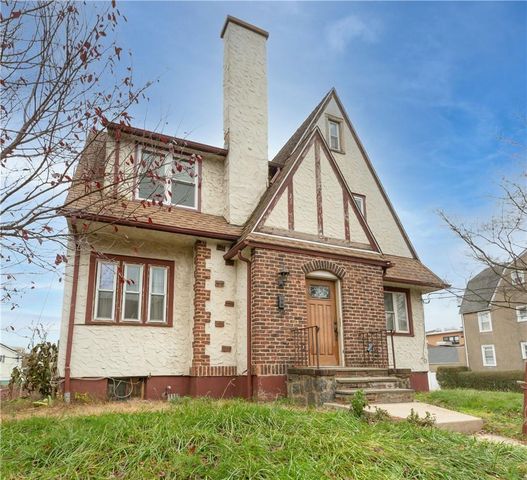front view of a house with a small yard