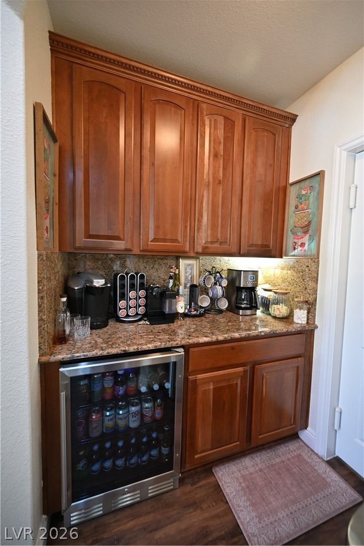 2729 Kildrummie Street Henderson, NV 89044 - Photo 12 of 42 A convenient beverage center provides ample storage and a coffee station with granite countertops.