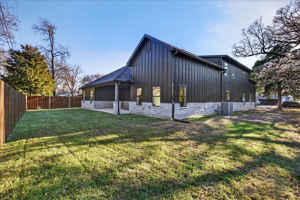 114 Castlewood Road Enchanted Oaks, TX 75156 - Photo 4 of 33 a view of a house with a yard patio and fire pit