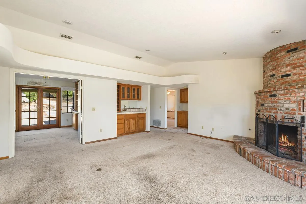 10099 El Capitan Real Road El Cajon, CA 92021 - Photo 14 of 41 a view of an empty room with a fireplace