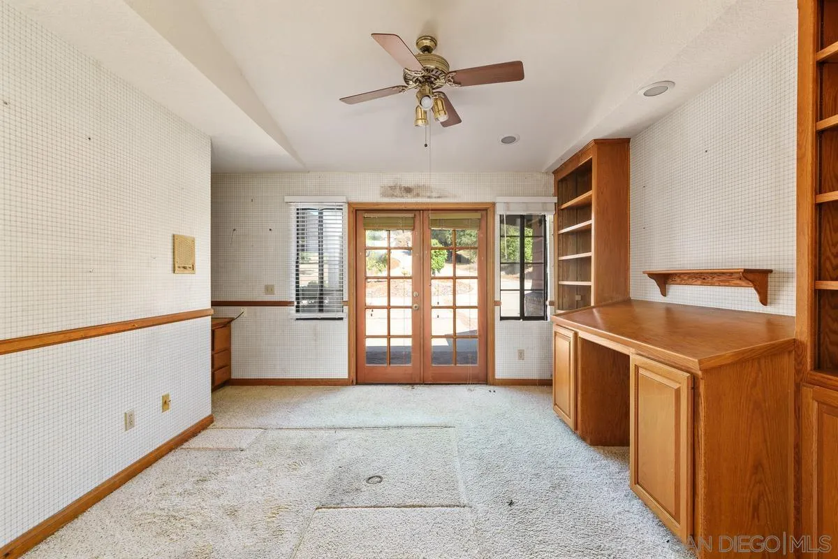 10099 El Capitan Real Road El Cajon, CA 92021 - Photo 19 of 41 a view of a kitchen with a sink and dishwasher with wooden floor