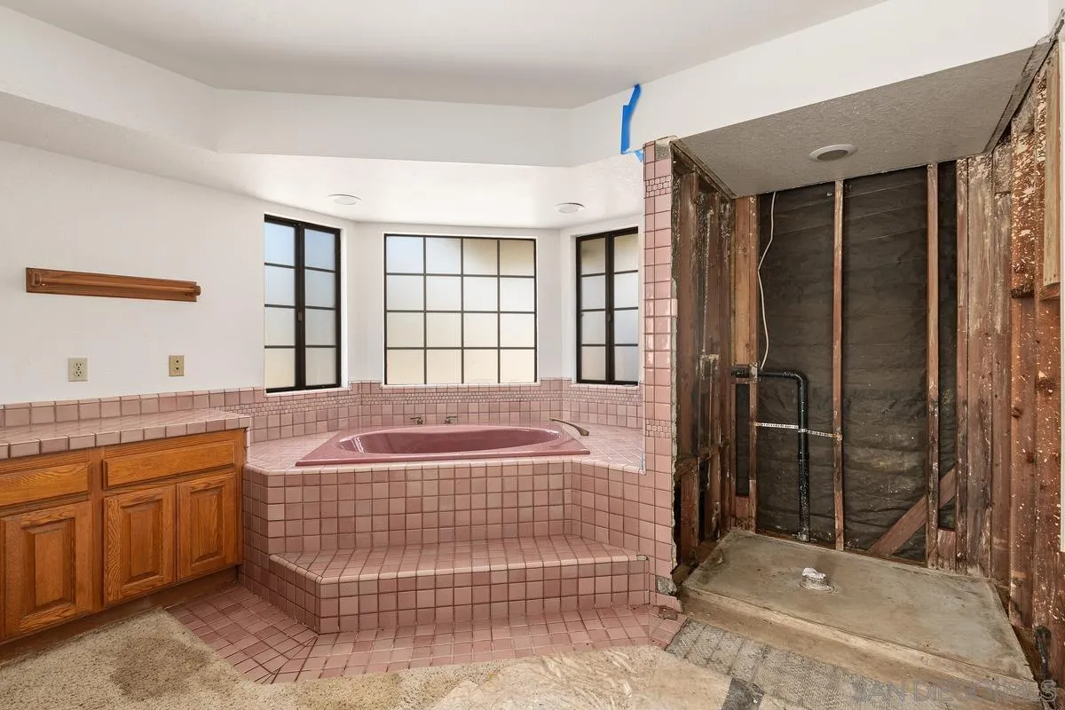 10099 El Capitan Real Road El Cajon, CA 92021 - Photo 27 of 41 a bathroom with a sink a toilet and shower