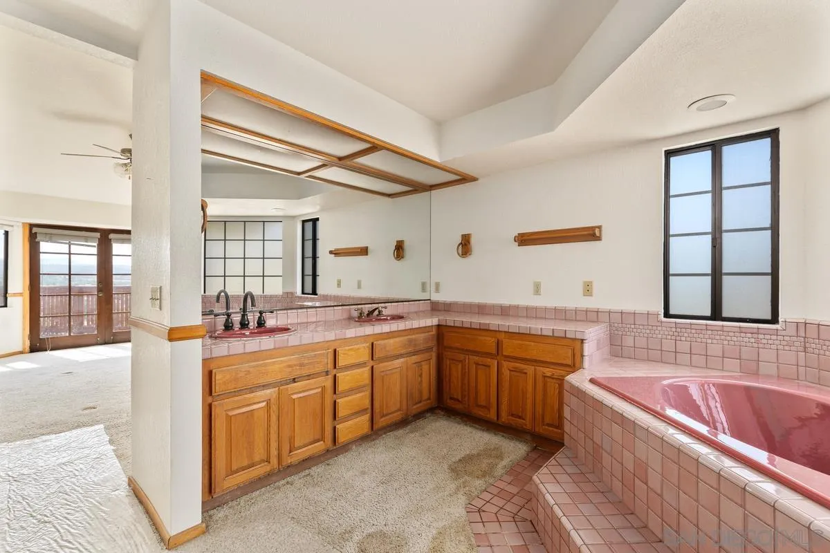 10099 El Capitan Real Road El Cajon, CA 92021 - Photo 28 of 41 a large bathroom with a large tub and sink