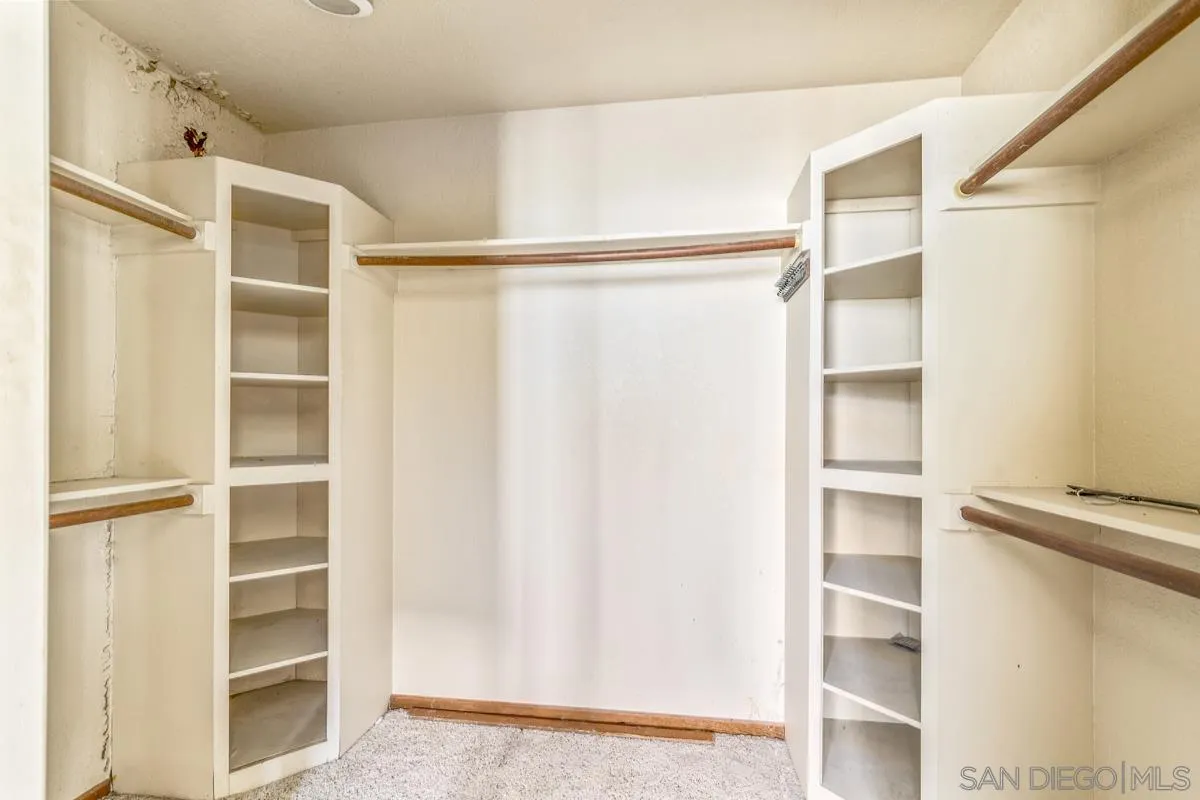10099 El Capitan Real Road El Cajon, CA 92021 - Photo 29 of 41 a view of walk in closet with empty racks