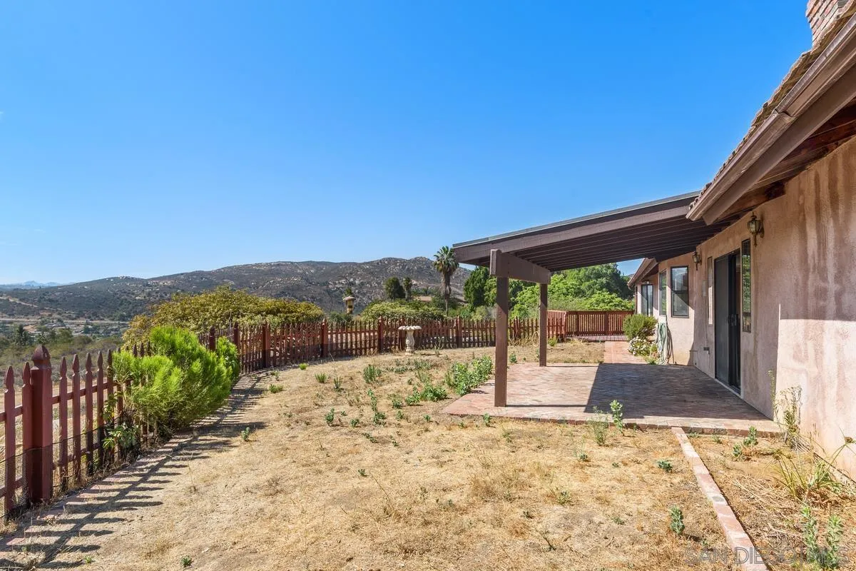 10099 El Capitan Real Road El Cajon, CA 92021 - Photo 30 of 41 a view of a backyard with a garden