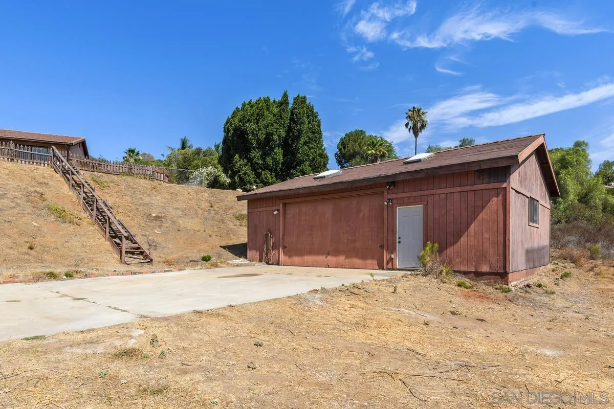 10099 El Capitan Real Road El Cajon, CA 92021 - Photo 34 of 41 a view of garage with wooden fence