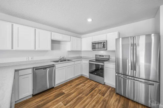 a view of kitchen with wooden floor
