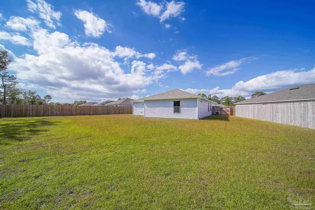 a view of a large room with a yard