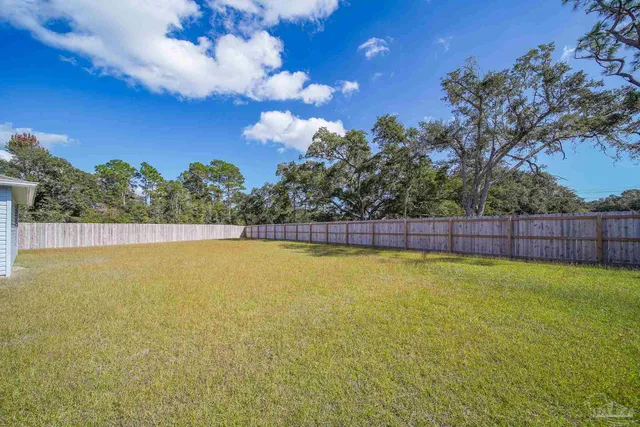 a view of a swimming pool with an outdoor space and seating area