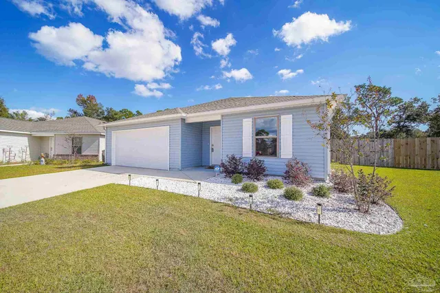 a view of a house with swimming pool and a yard
